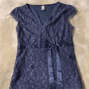 Woman’s blue lace top